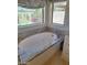 Luxurious bathroom featuring a soaking tub with granite surround and natural light at 7527 E Nestling Way, Scottsdale, AZ 85255