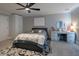 Cozy bedroom features a ceiling fan, neutral walls, and a neutral carpet at 7527 E Nestling Way, Scottsdale, AZ 85255