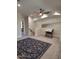Open bonus room with a pitched ceiling, stylish floral rug and bright, neutral decor at 7527 E Nestling Way, Scottsdale, AZ 85255
