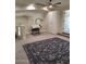 Open bonus room with neutral carpeting and an art nook, plus a view of other rooms at 7527 E Nestling Way, Scottsdale, AZ 85255