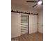 Bedroom closet featuring white doors, shelves and drawers with black hardware at 7527 E Nestling Way, Scottsdale, AZ 85255