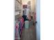 Walk-in closet with shelving, hanging rods, and ample storage space at 7527 E Nestling Way, Scottsdale, AZ 85255