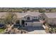 Beautiful two-story home featuring a well-manicured yard and a spacious three-car garage at 7527 E Nestling Way, Scottsdale, AZ 85255