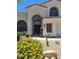 Charming single-story home featuring a welcoming entrance and desert landscaping at 7527 E Nestling Way, Scottsdale, AZ 85255