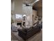 Open living room with fireplace, recessed lighting, tall ceilings, and hardwood floors at 7527 E Nestling Way, Scottsdale, AZ 85255
