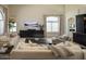 Spacious living room featuring a modern design with luxury furniture and expansive windows at 7527 E Nestling Way, Scottsdale, AZ 85255