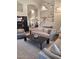 Elegant living room boasting high ceilings, a fireplace, and neutral decor at 7527 E Nestling Way, Scottsdale, AZ 85255
