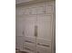 Custom-built pantry with ample shelving and storage space, complemented by sleek hardware at 7527 E Nestling Way, Scottsdale, AZ 85255