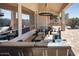 Comfortable outdoor seating area on a covered patio with a view of the backyard at 7527 E Nestling Way, Scottsdale, AZ 85255