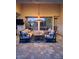 Elegant outdoor seating area with comfortable furniture, stylish lighting, and serene views of the backyard at 7527 E Nestling Way, Scottsdale, AZ 85255