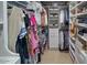 Spacious walk-in closet featuring shelving, hanging rods, and plenty of storage at 7527 E Nestling Way, Scottsdale, AZ 85255
