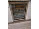Sub-Zero wine fridge with glass door, offering precise temperature control and stylish beverage storage at 7527 E Nestling Way, Scottsdale, AZ 85255