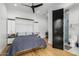 Modern bedroom with built-in Murphy bed, sleek cabinetry, and access to a stylish bathroom at 7851 N Central Ave, Phoenix, AZ 85020