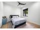 Bright bedroom with a bed, hardwood floors and black trim window at 7851 N Central Ave, Phoenix, AZ 85020