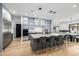 Spacious kitchen featuring modern cabinetry, a large island with seating, and stainless steel appliances for the home chef at 7851 N Central Ave, Phoenix, AZ 85020