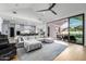 Bright and airy living room with a large sectional sofa, vaulted ceiling, and seamless access to the outdoor patio at 7851 N Central Ave, Phoenix, AZ 85020