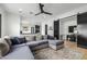 The open-concept living room connects seamlessly to the kitchen and features a large sectional sofa for relaxation at 7851 N Central Ave, Phoenix, AZ 85020