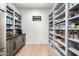 Walk-in pantry with custom shelving and cabinetry, providing ample storage space for all your culinary needs at 7851 N Central Ave, Phoenix, AZ 85020
