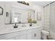 Bright bathroom featuring a double sink vanity, contemporary fixtures, and a clean, modern design at 8000 W Griswold Rd, Peoria, AZ 85345