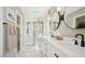 Modern bathroom featuring a walk-in shower, double vanity, and sophisticated fixtures for a spa-like atmosphere at 8000 W Griswold Rd, Peoria, AZ 85345
