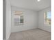 Bedroom featuring soft carpet, and natural light from two large windows at 8000 W Griswold Rd, Peoria, AZ 85345