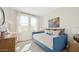 Bright bedroom features natural light, daybed, neutral paint, and comfortable furnishings at 8000 W Griswold Rd, Peoria, AZ 85345