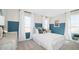 Charming bedroom with a single bed, bright windows, and stylish blue-and-white decor at 8000 W Griswold Rd, Peoria, AZ 85345