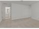 Spacious bedroom, neutral walls and carpet, and bathroom entry at 8000 W Griswold Rd, Peoria, AZ 85345