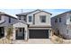 Stunning two-story home with a gray stucco facade, dark gray tiled roof and spacious two car garage at 8000 W Griswold Rd, Peoria, AZ 85345