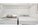 Functional laundry area with modern side-by-side washer and dryer at 8000 W Griswold Rd, Peoria, AZ 85345