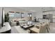 Inviting living room with comfortable seating, modern coffee tables, and access to the backyard patio at 8000 W Griswold Rd, Peoria, AZ 85345
