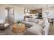Inviting living space flows into a well-equipped kitchen and dining area, perfect for modern living at 8000 W Griswold Rd, Peoria, AZ 85345