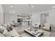 Bright open-concept living space showcasing modern kitchen and comfortable seating arrangement at 8000 W Griswold Rd, Peoria, AZ 85345