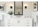 Elegant bathroom featuring a white vanity, decorative lighting, and contemporary design at 8024 W Griswold Rd, Peoria, AZ 85345