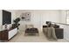 Cozy upstairs lounge area featuring comfortable seating, a TV, and stylish decor for relaxation and entertainment at 8024 W Griswold Rd, Peoria, AZ 85345