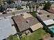 Aerial view of a well-maintained home with a large backyard, mature landscaping, and a covered patio at 8713 E Sage Dr, Scottsdale, AZ 85250