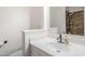 Bathroom features a white sink, decorative soap, and a brown tiled shower at 8713 E Sage Dr, Scottsdale, AZ 85250