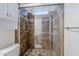 Bathroom featuring glass enclosed tiled shower with updated fixtures at 8713 E Sage Dr, Scottsdale, AZ 85250