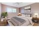 Staged bedroom with neutral walls, hardwood floors, and updated furnishings at 8713 E Sage Dr, Scottsdale, AZ 85250