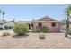 Attractive brick home featuring desert landscaping with gravel and mature shrubs at 8713 E Sage Dr, Scottsdale, AZ 85250