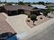 Charming single-story red brick home featuring a curved driveway and well-maintained landscaping at 8713 E Sage Dr, Scottsdale, AZ 85250