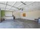 Spacious garage interior featuring automatic door opener and plenty of room for parking and storage at 8713 E Sage Dr, Scottsdale, AZ 85250