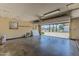 Bright garage interior with an open door view to the outside and ample natural light at 8713 E Sage Dr, Scottsdale, AZ 85250