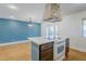 Spacious kitchen island has an oven and lots of countertop space at 8713 E Sage Dr, Scottsdale, AZ 85250