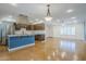 Open kitchen features an island with barstool seating and stainless steel appliances at 8713 E Sage Dr, Scottsdale, AZ 85250