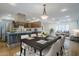 A dining table connects the open-concept kitchen and living room at 8713 E Sage Dr, Scottsdale, AZ 85250