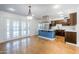 Open kitchen has wooden cabinets, stainless appliances, and island with seating at 8713 E Sage Dr, Scottsdale, AZ 85250