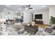 Stylishly decorated living room with coordinated furniture, a large TV, and an open-concept design at 8713 E Sage Dr, Scottsdale, AZ 85250