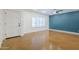 Bright living room with white walls, polished floors, and a contemporary ceiling fan at 8713 E Sage Dr, Scottsdale, AZ 85250