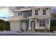 Charming two-story home showcasing a neutral color palette, covered porch, and a two-car garage at 8807 W Pasadena Ave, Glendale, AZ 85305